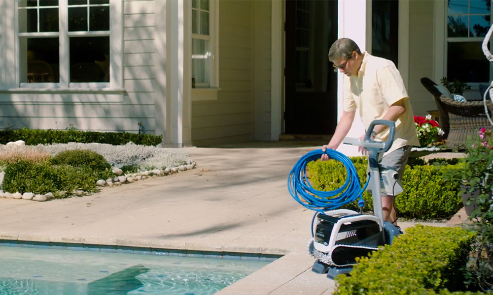 Dolphin E70 Robotic Pool Cleaner Using Caddy