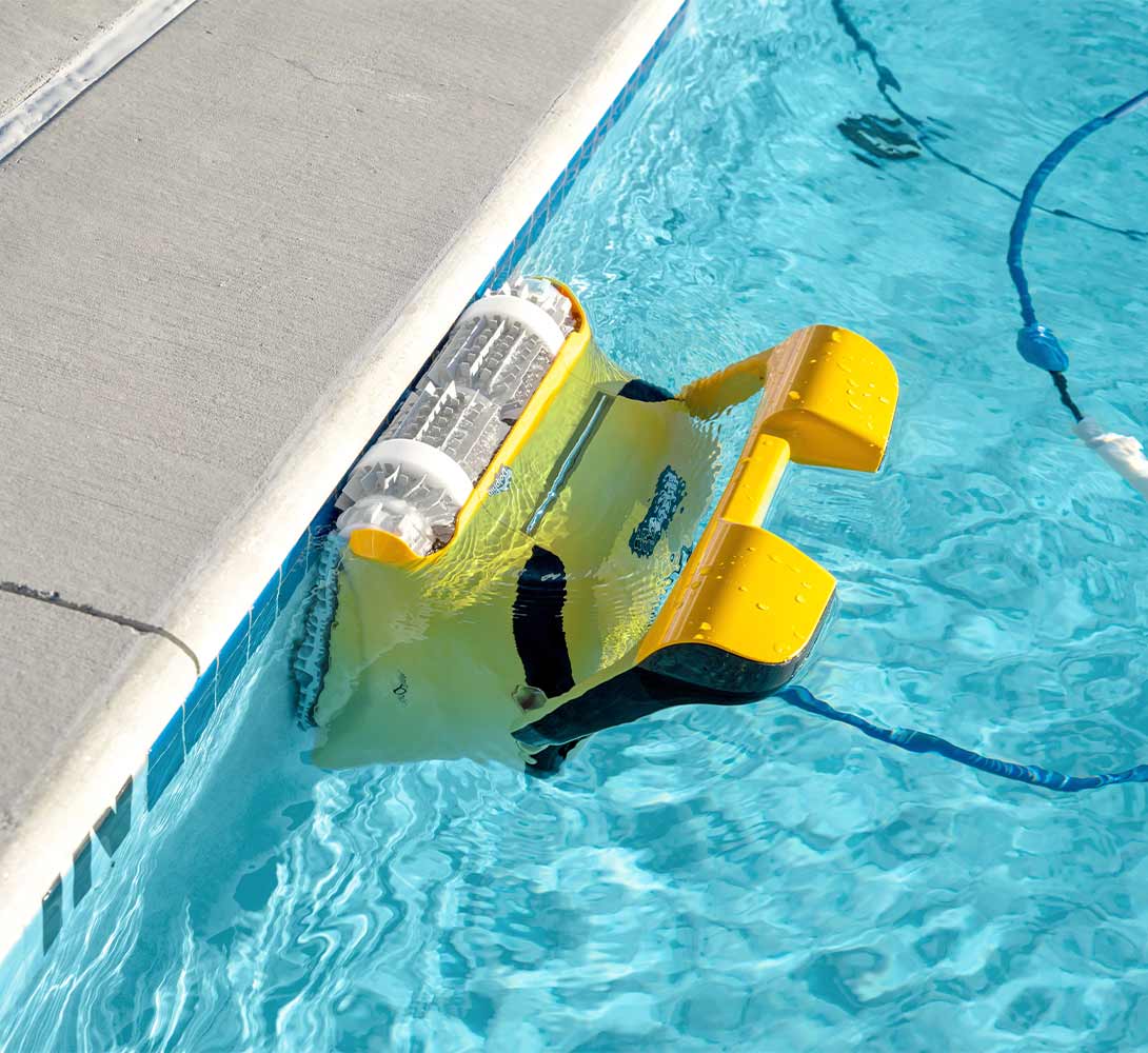 Dolphin Wave 80 cleaning the waterline of a commercial pool